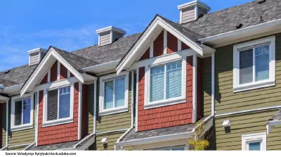 Photo showing a row of apartments from the outside.