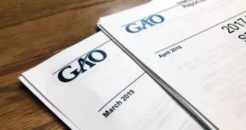 GAO reports laying on a desk