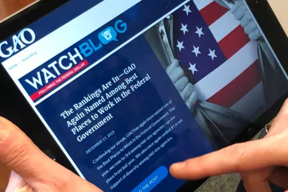 user reading the WatchBlog on a tablet