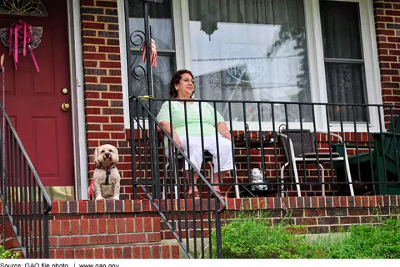 Older woman sitting on porch