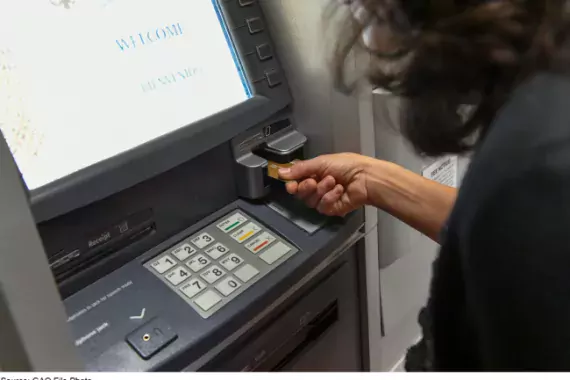 Photo of woman at ATM