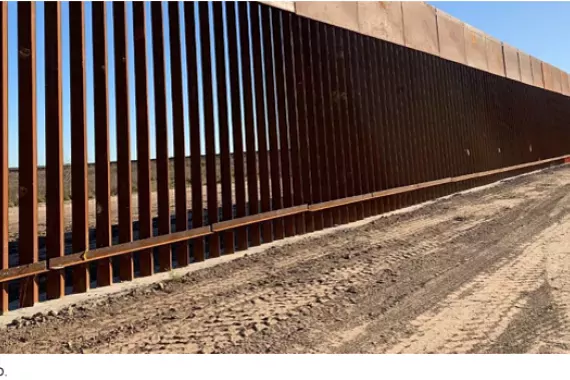 Photo of metal slats comprising the southern border wall with Mexico