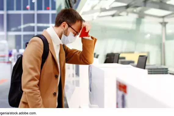 Airport check-in sad traveler