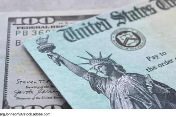 A United States Treasury check with a one-hundred-dollar bill.