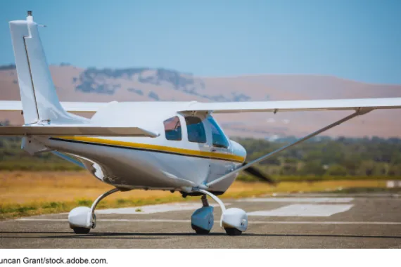A small plane preparing to take off on an airport runway.