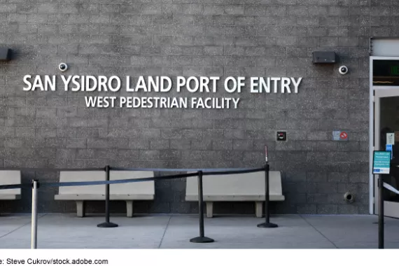 A concrete building wall that says San Ysidro Land Port of Entry, West Pedestrian Facility