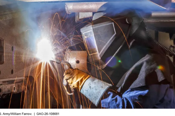 Welder repairing a ground vehicle at Anniston Army Depot.