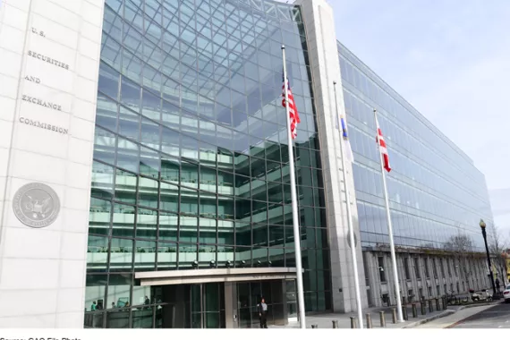 Photo of the Securities and Exchange Commission building with several windows and flag poles.