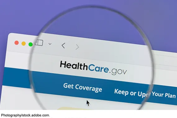Image showing the HealthCare.gov website with a spyglass enlarging the words 'HealthCare.gov' and 'Get Coverage.'