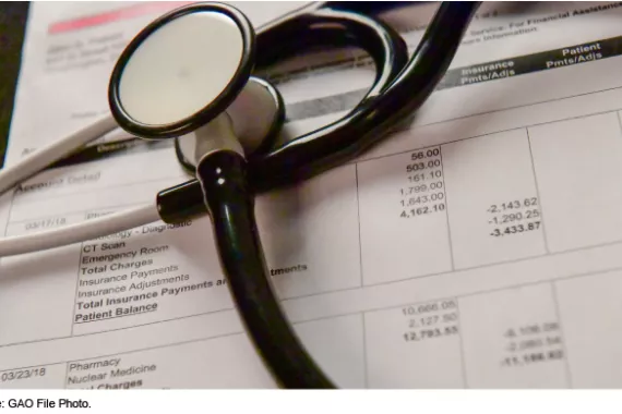 Stethoscope atop a medical bill
