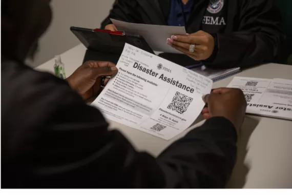 FEMA staff helping survivors of the 2025 Los Angeles wildfires register for assistance.