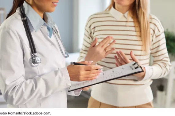 A physician consulting with a patient 