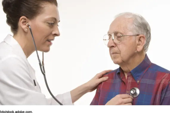 Person using a stethoscope on an elderly person