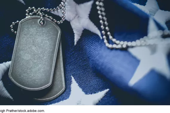 United States flag and military identification tags.