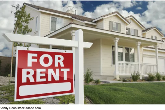A single-family home with a 'For Rent' sign in the front yard.