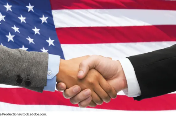 Handshake in front of American flag