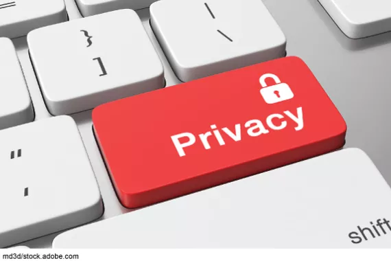 A keyboard with a red button that says privacy and has a padlock on it.