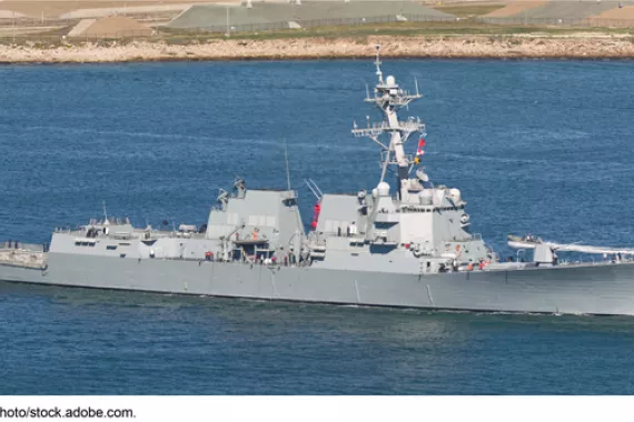 A large military ship in the water  AI-generated content may be incorrect.