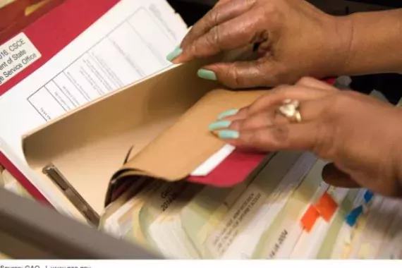 Photo of Someone Checking Files