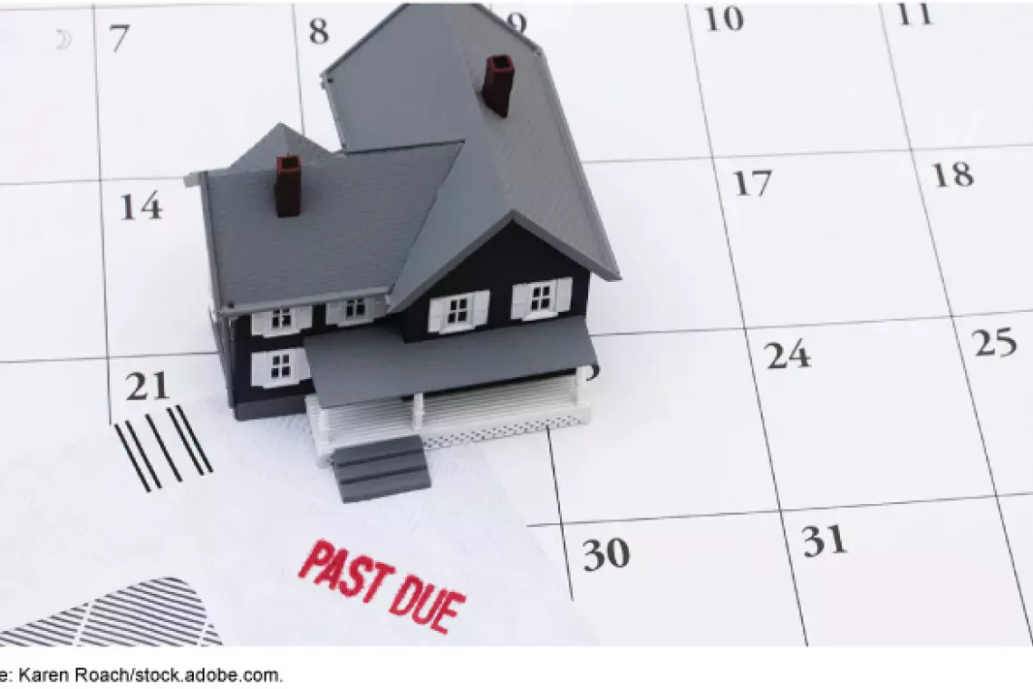 Illustration of a toy house on top of a calendar showing an overdue bill