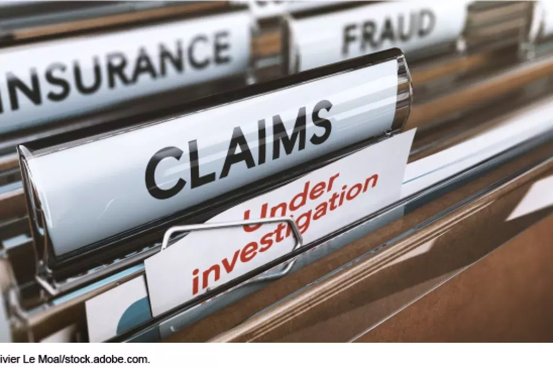 Photo showing a filing cabinet folders marked &quot;fraud,&quot; &quot;Insurance,&quot; Claims&quot; and &quot;Under Investigation&quot;