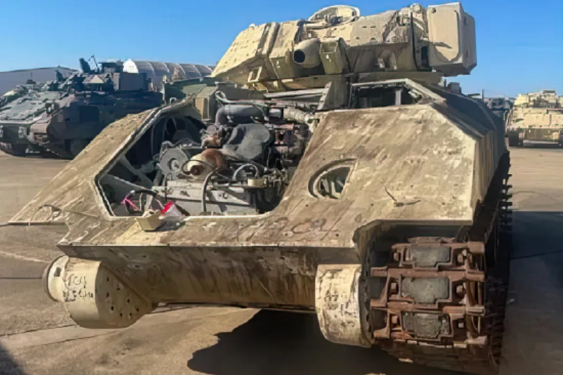 Photo showing a Bradley Fighting Vehicle that needs major repairs.