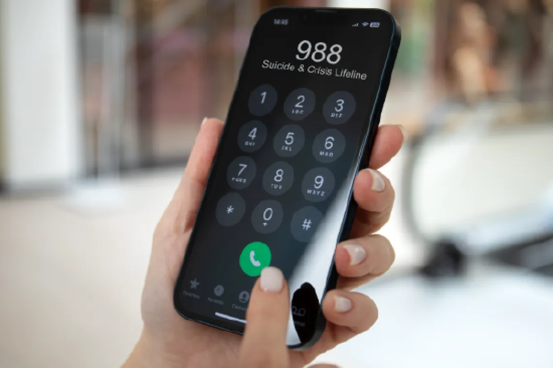A phone where the 988 crisis line is being called.