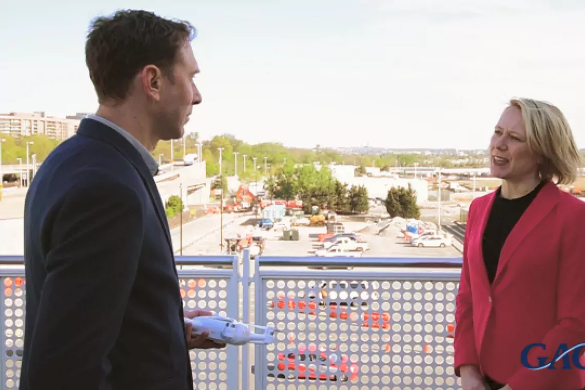 Heather Krause, a director in GAO's Physical Infrastructure team, speaking outside of Reagan National Airport